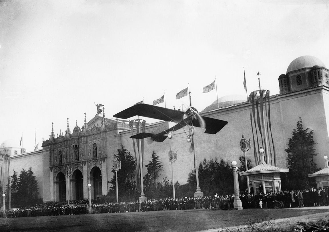 Lincoln Beachey waving to the crowd from his monoplane at the Panama-Pacific International Exposition, San Francisco  March 14, 1915