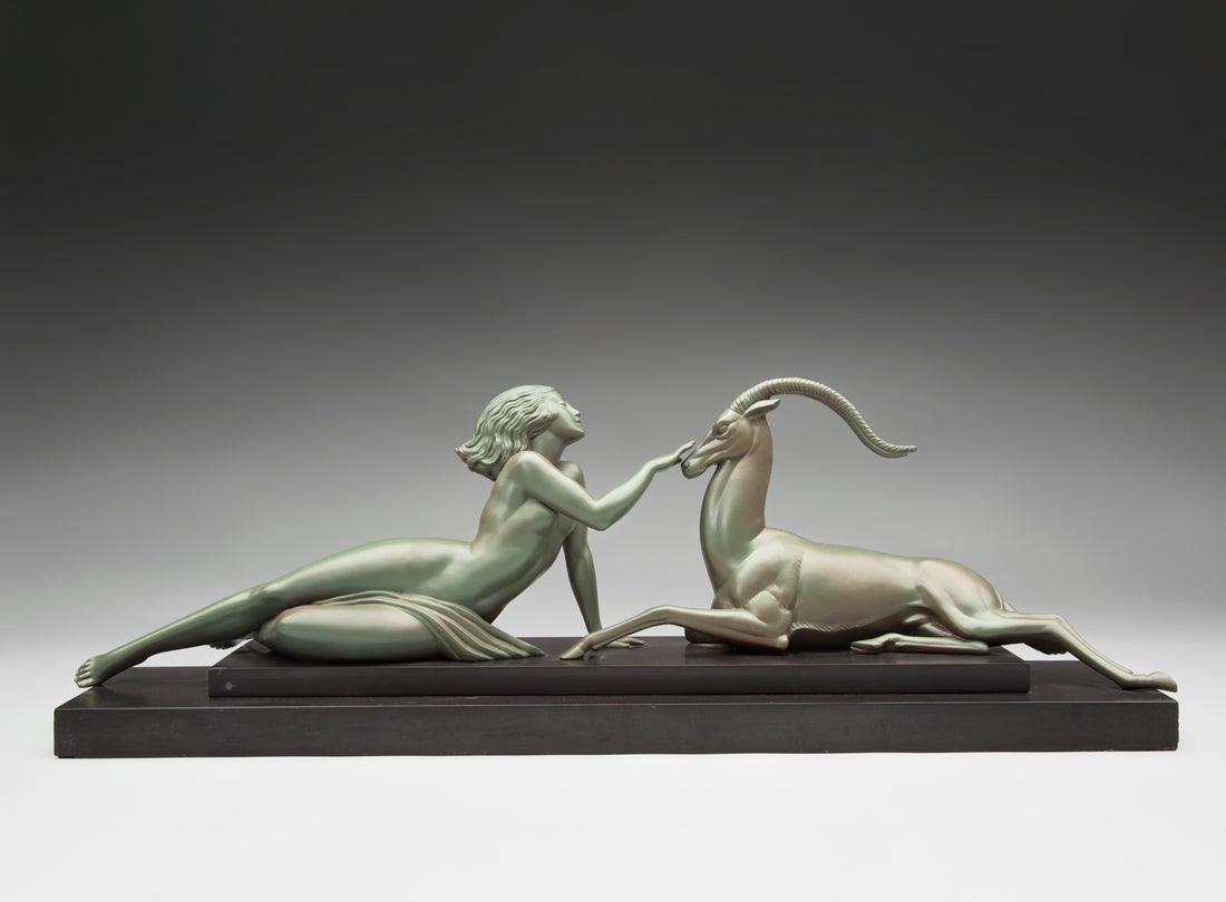 Woman petting a gazelle