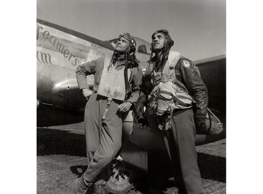 332nd Fighter Group pilots: (L-R) Col. Benjamin O. Davis, Commanding Officer, and Edward C. Gleed, Group Operations Officer, with North American P-51D Mustang  March 1945
