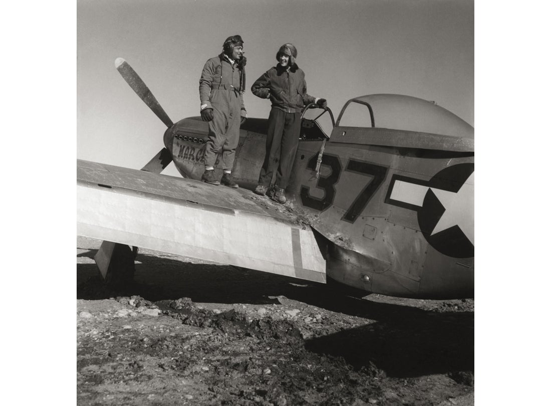 Photographer Toni Frissell with Major George S. Roberts on the wing of his North American P-51D Mustang  March 1945