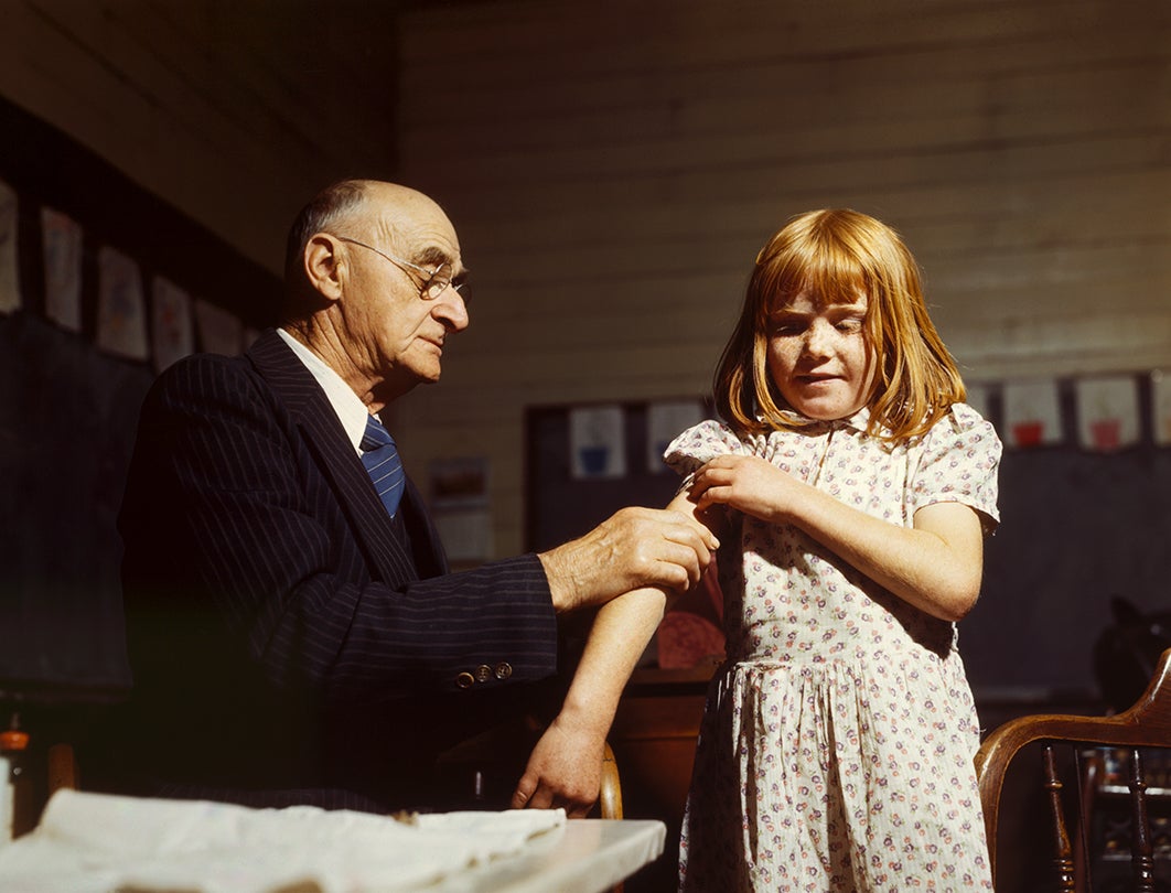 Dr. Schreiber giving a typhoid inoculation at a rural school, San Augustine County, Texas  1943