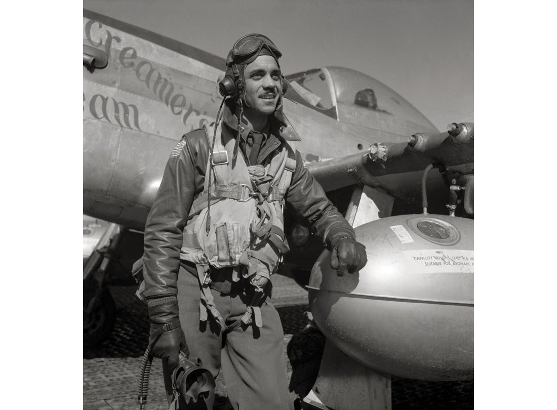 332nd Fighter Group Operations Officer Edward C. Gleed stands next to his North American P-51D Mustang March 1945
