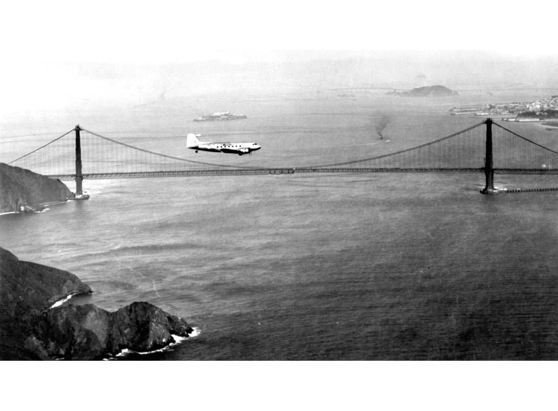 United Air Lines, Douglas DC-3 Mainliner flying over the San Francisco Bay c. 1945