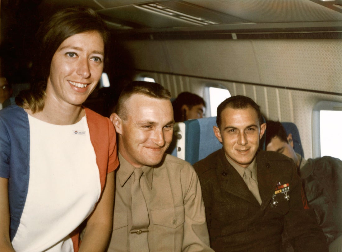 United Air Lines flight attendant Sandra Herrmann on board a MAC Charter Flight  c. 1968