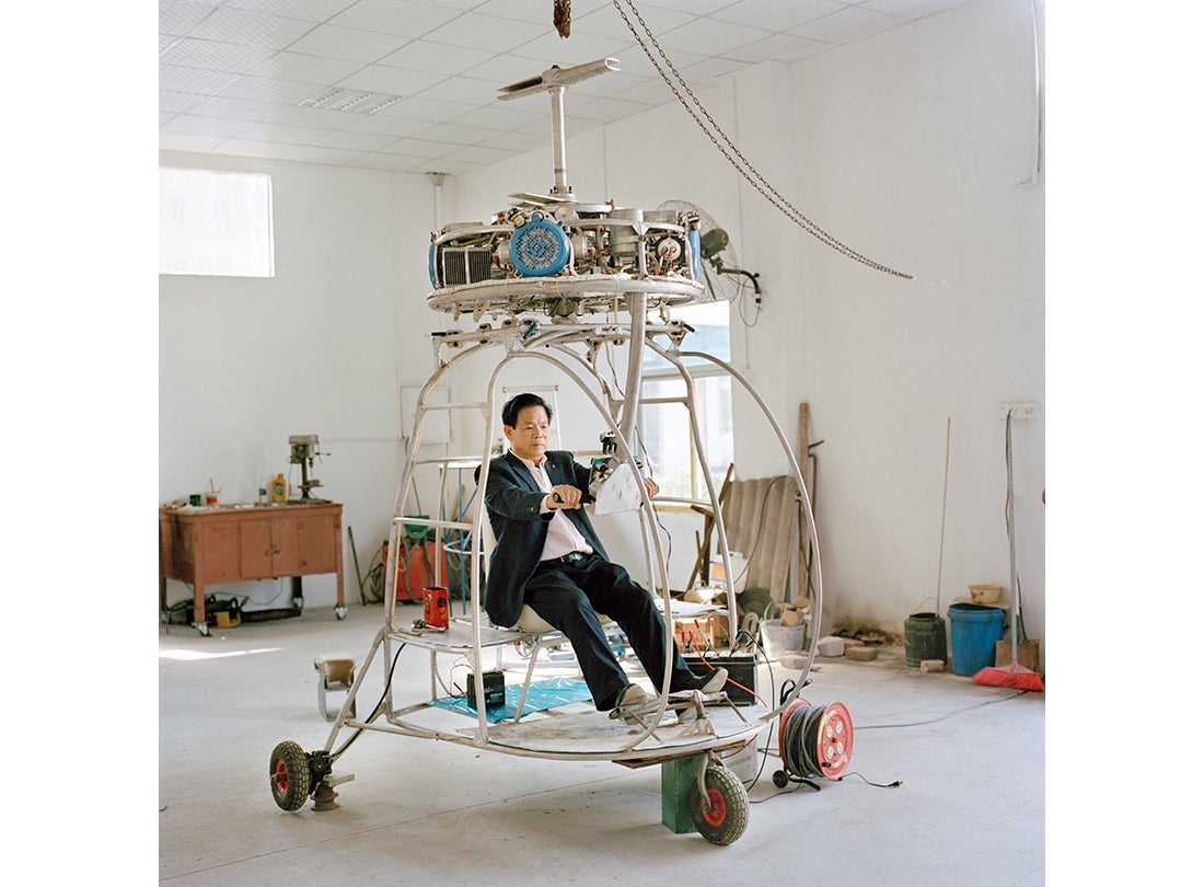 Zhang Dousan works in construction and works on Dousan No. 5 in his spare time—he has spent three years and more than $70,000 working on this coaxial-type helicopter  2015   