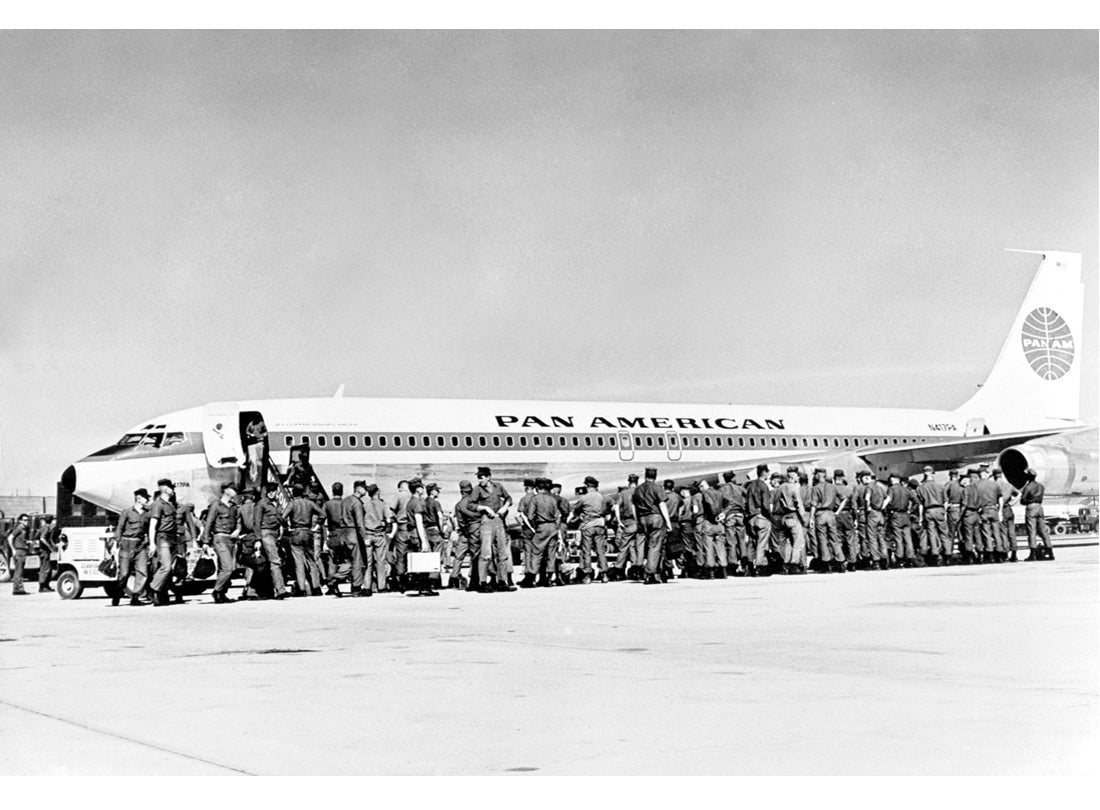 Soldiers waiting to board a Pan American World Airways Boeing 707  c. 1967