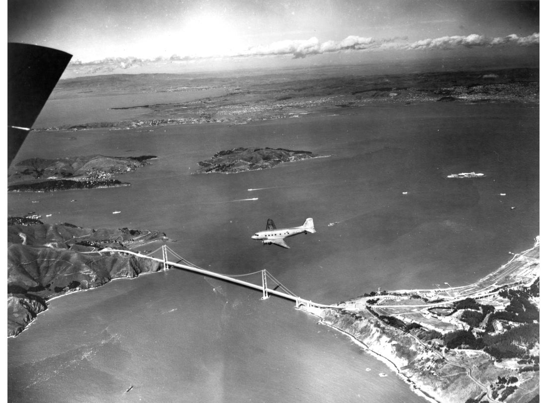 TWA (Trans World Airlines) Douglas DC-3 above the Golden Gate Bridge c. 1945