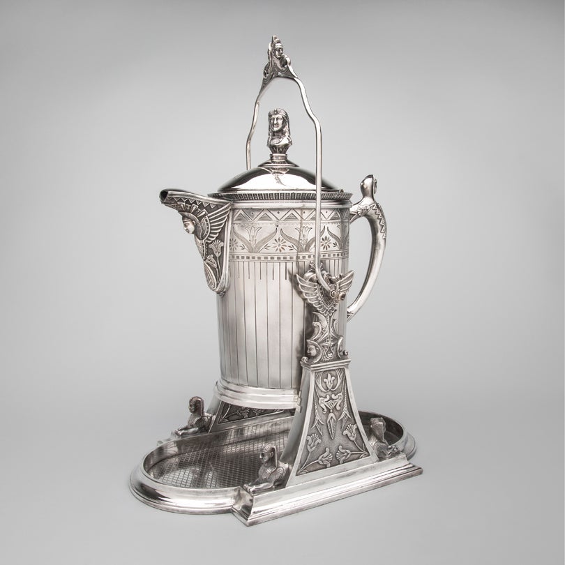 Tilting ice water pitcher  c. 1870s  Rogers, Smith, & Company  Meriden, CT silver plate L2014.2906.002.01-.03