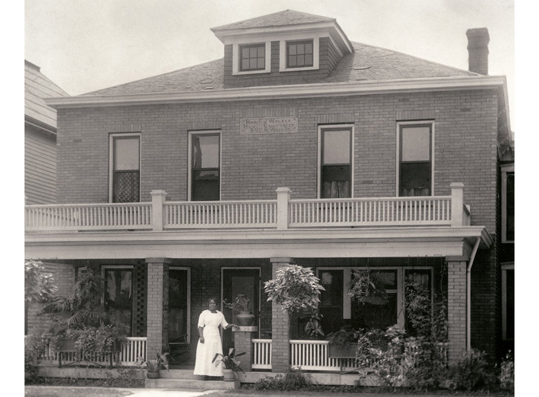 Madam C. J. Walker in front of her home and business