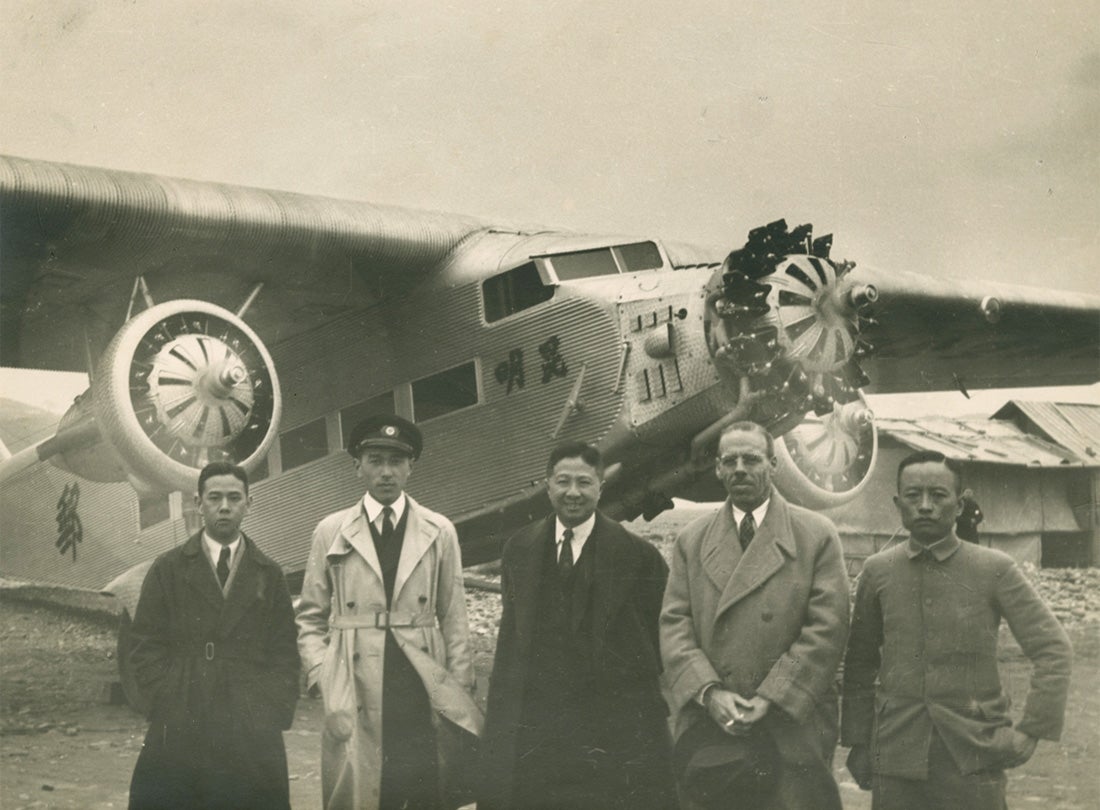 (from left) CNAC Radio Operator Joe Loh, Captain Donald S. Wong, Director Ki Chun, Pan American Airways Far Eastern representative Harold M. Bixby, and Assistant Operations Manager K. I. Nieh and Ford Tri-Motor  1937