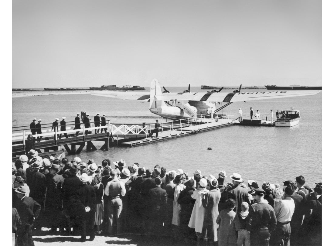 Flight crew marching to the China Clipper to depart Alameda for the first scheduled flight  1935