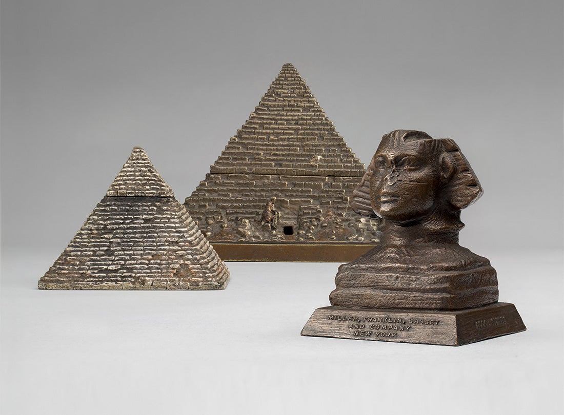 Pyramid inkwell and cigarette box  c. 1890  United States or Europe  bronze Collection of Ace Architects L2014.2902.007, .008  Sphinx  c. 1920s  New York  copper-plated lead Collection of Ace Architects L2014.2902.009