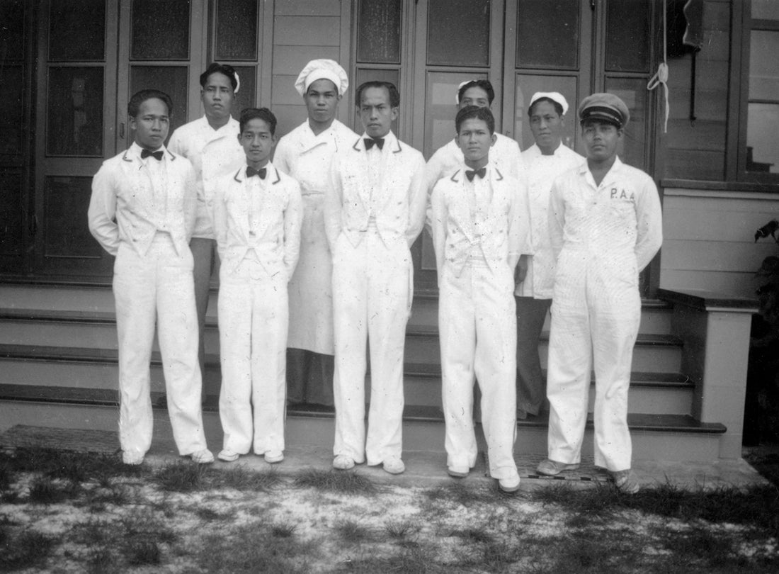 Pan American Airways Inn staff at Midway Island, from left to right back row: Guittierez Lorenzo, Jose Anderson, unknown, Jose Jesus, front row: Juan Concepcion, Vicente Van Pat, Francisco Valenzuela, Vicente Rivera, Juan Taijito c. 1937 