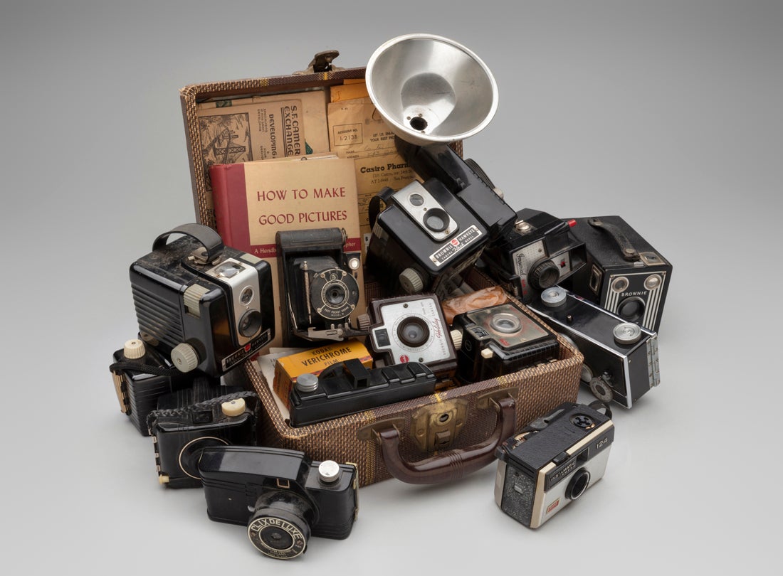 Suitcase with Cameras  1984–ongoing Mickey McGowan (b. 1946) suitcase, cameras, photographs, film canisters, negatives, pamphlets Courtesy of Mickey McGowan, Unknown Museum Archives L2023.0301.010.01, .03–.19