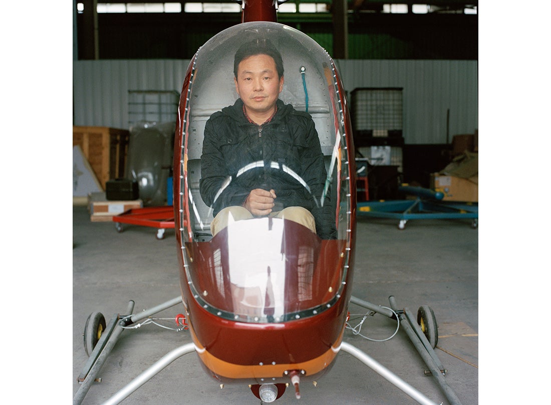 He Dongbiao sits inside his helicopter Low Altitude Free Man, which utilizes an MZ202 aeromotor. It took him one year to construct and flies as high as 1,300 feet  2015