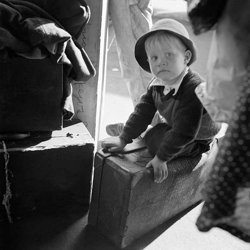 Small boy waiting for the bus in Chattanooga, Tennessee  1943