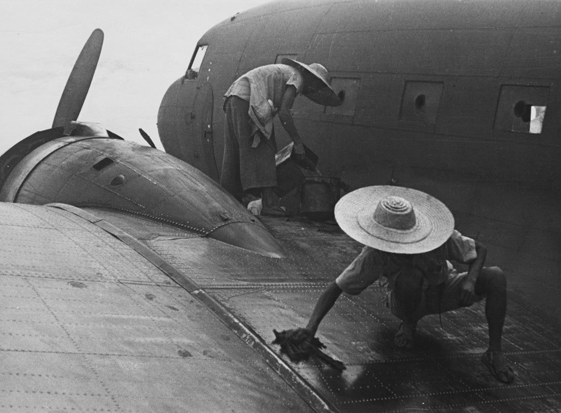 CNAC ground crew fueling Douglas C-47 (DC-3), Suifu  1944