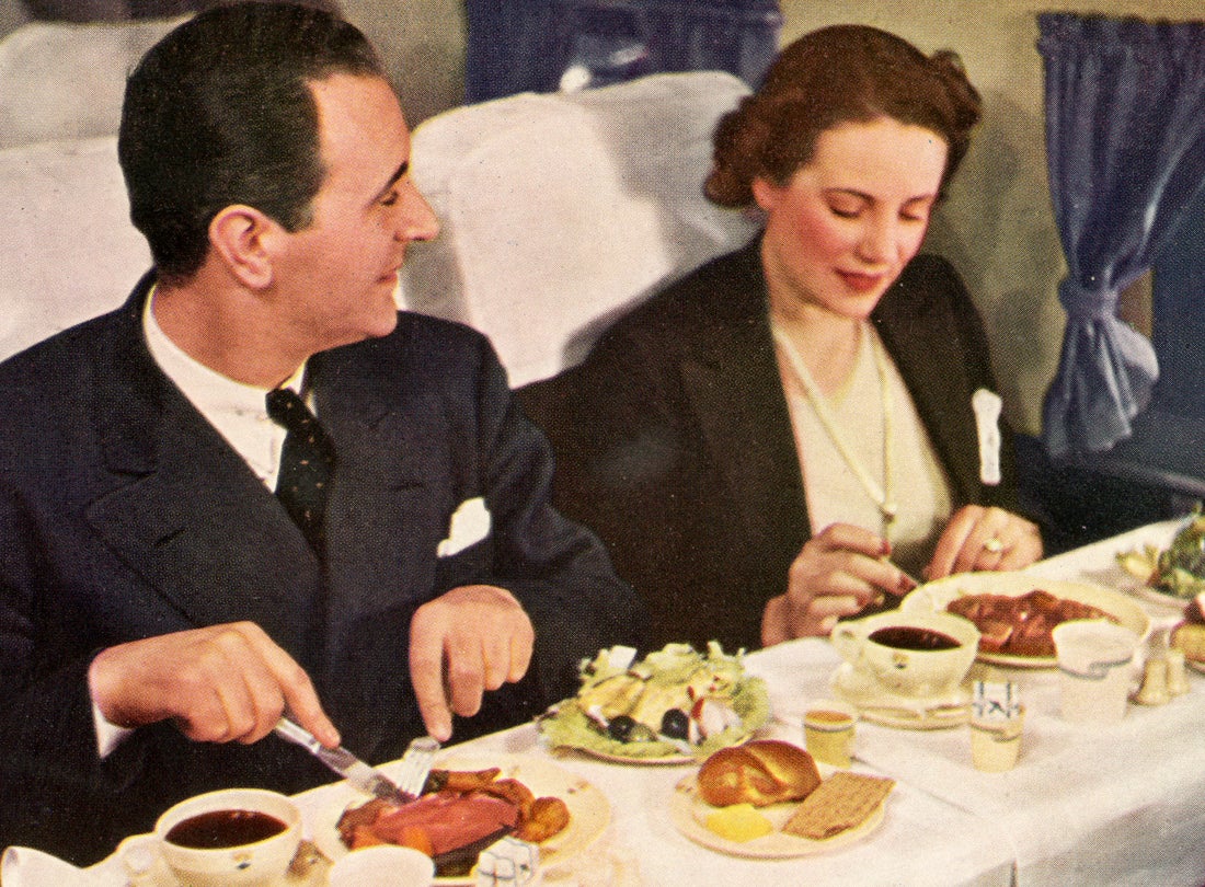 Meal service aboard a United Air Lines DC-3 Mainliner (postcard from United Air Lines stewardess Helene Dessiaume’s scrapbook)  late 1930s