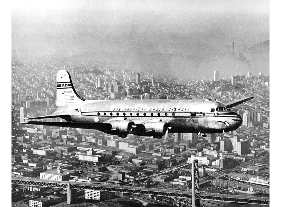 Pan American Airways, DC-4 with the Golden Gate Bridge in the background  c. 1950