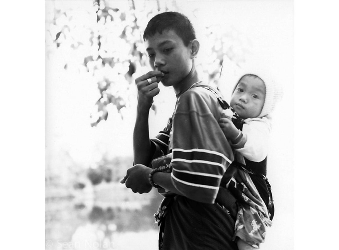 Boy with Baby, Mekong Delta, Vietnam
