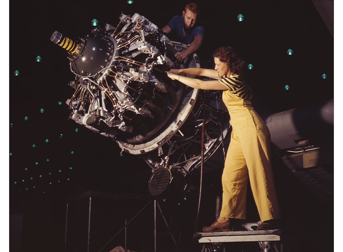 Work on a Pratt & Whitney R-1830 Twin Wasp aircraft engine mounted on a Douglas C-47 Dakota military transport