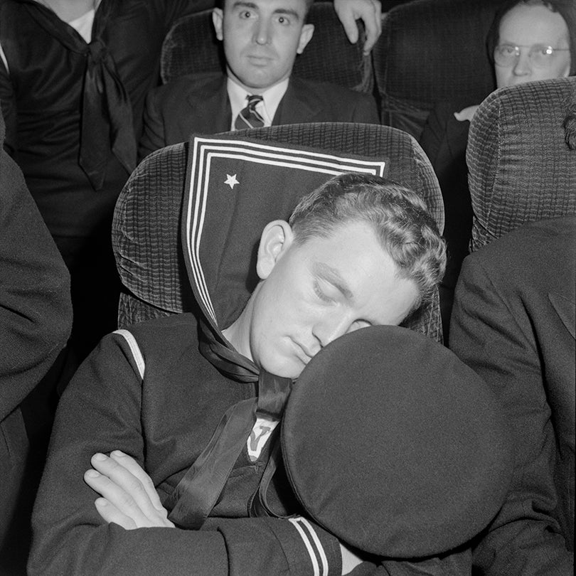 A sailor asleep on a bus enroute from Roanoke, Virginia, to Washington, D.C.  1943