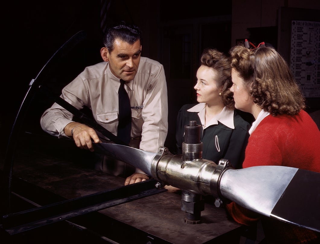 Ralph Angar, instructor, explains propeller characteristics to students in an aeronautics class, Los Angeles, California  1942