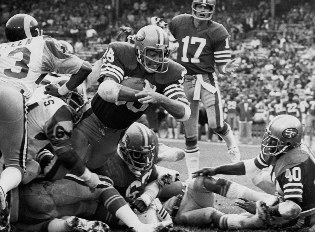 Running back Paul Hofer dives for a touchdown during a 20-26 loss to the Los Angeles Rams at Candlestick Park