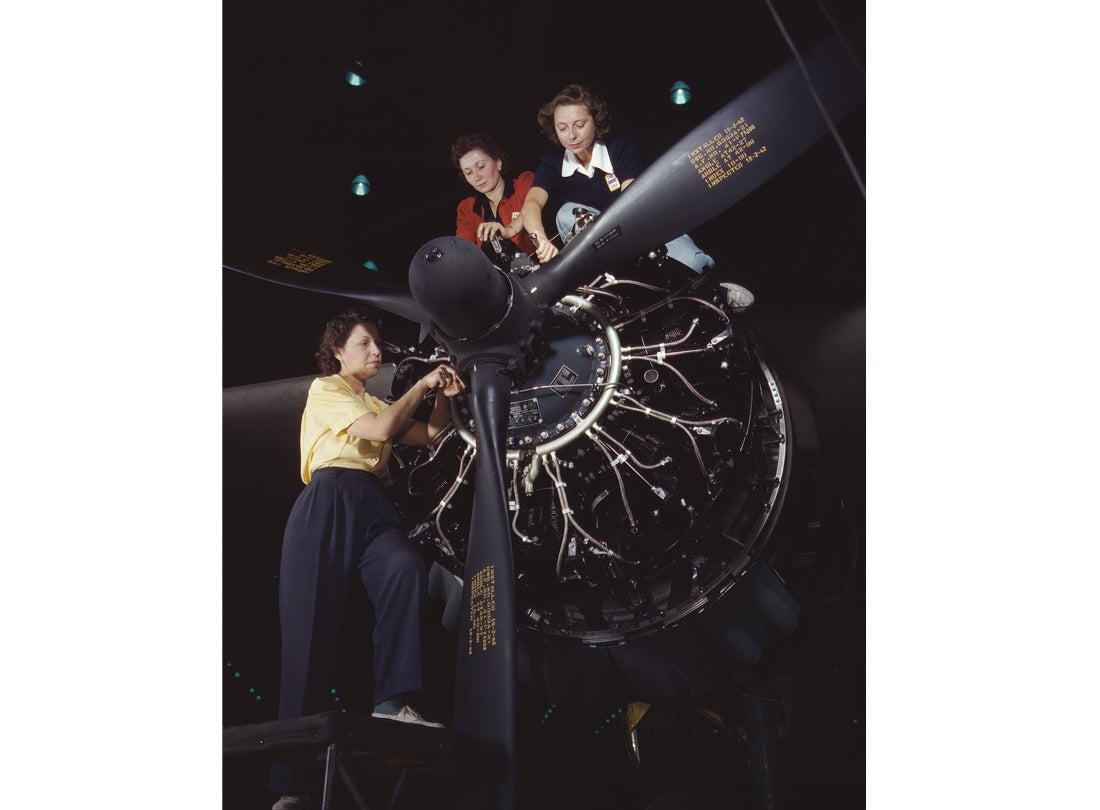 Work on a Pratt & Whitney R-1830 Twin Wasp aircraft engine mounted on a Douglas C-47 Dakota military transport