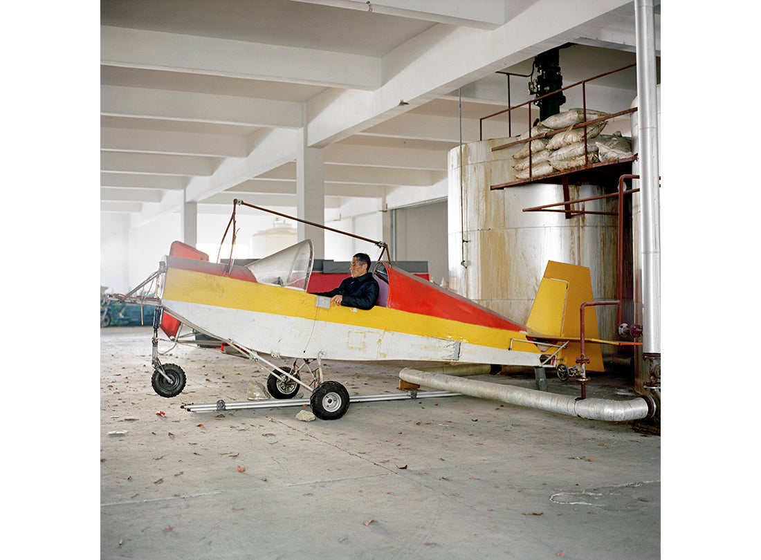 Jin Shaozhi shows off the Sky Horse, a fixed-wing aircraft with a steel frame, aluminum tubing, and a Rotax 447 motor  2015