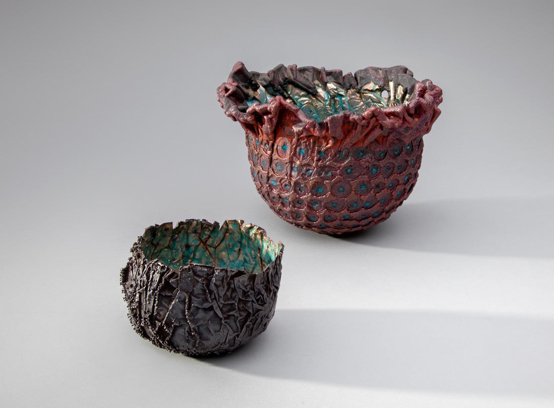 Vessel (#2479)  2012 June Schwarcz (b. 1918) electroplated copper foil, blue enamel interior, oxidized exterior L2013.2601.093.04  Vessel (#547)  1969 June Schwarcz (b. 1918) electroformed copper foil, plique-à-jour enamel, naturally oxidized copper exterior L2013.2601.033