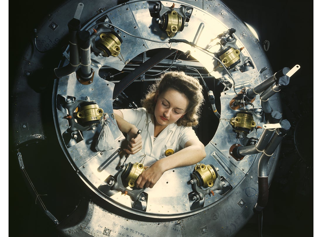 Assembling part of the engine cowling for a North American B-25 Mitchell bomber at the North American Aviation plant