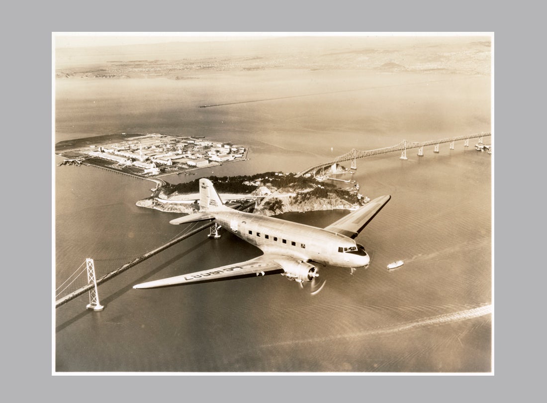 United Air Lines DC-3 over the Bay Bridge  c. 1940