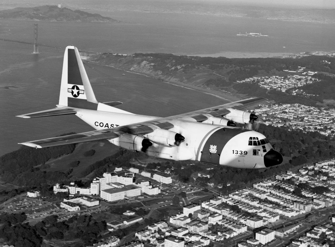 Lockheed HC-130H Hercules flies over the Golden Gate and the Veterans Administration Hospital  1976