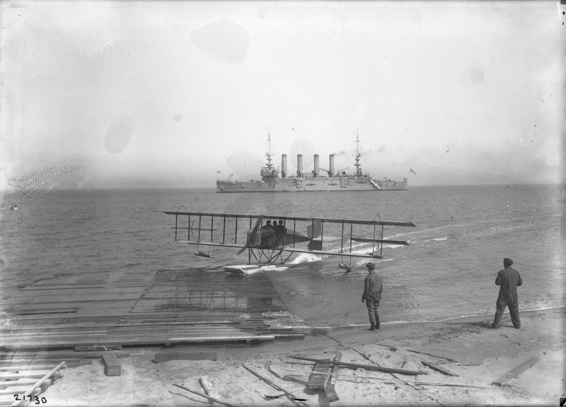 Loughead hydroplane and passenger Ralph Geddes beaching with the cruiser USS Milwaukee off the Panama-Pacific International Exposition, San Francisco  1915