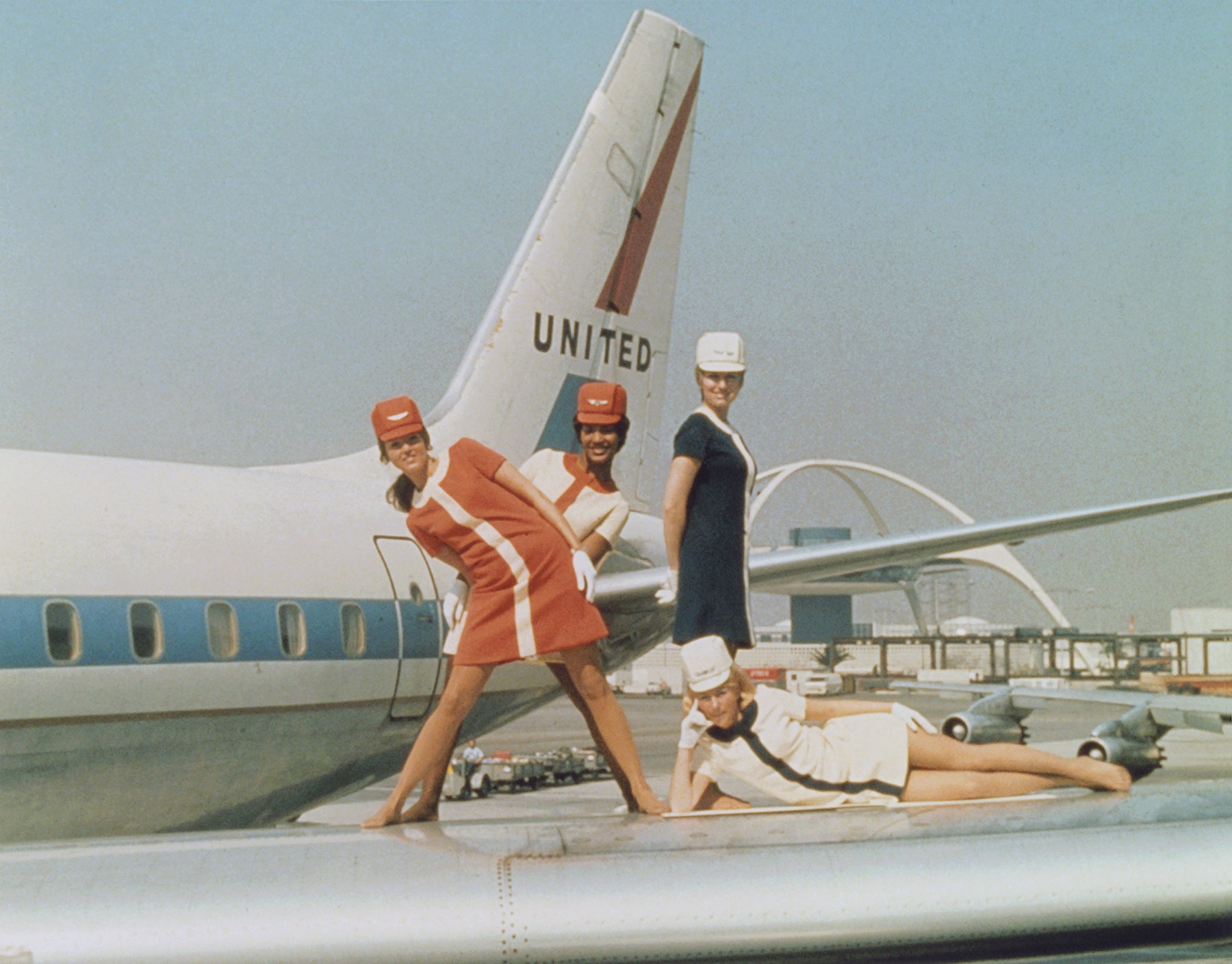 United Air Lines flight attendants on the wing of a Douglas DC–8 airliner spell “XL” to commemorate forty years of the flight attendant profession  1970