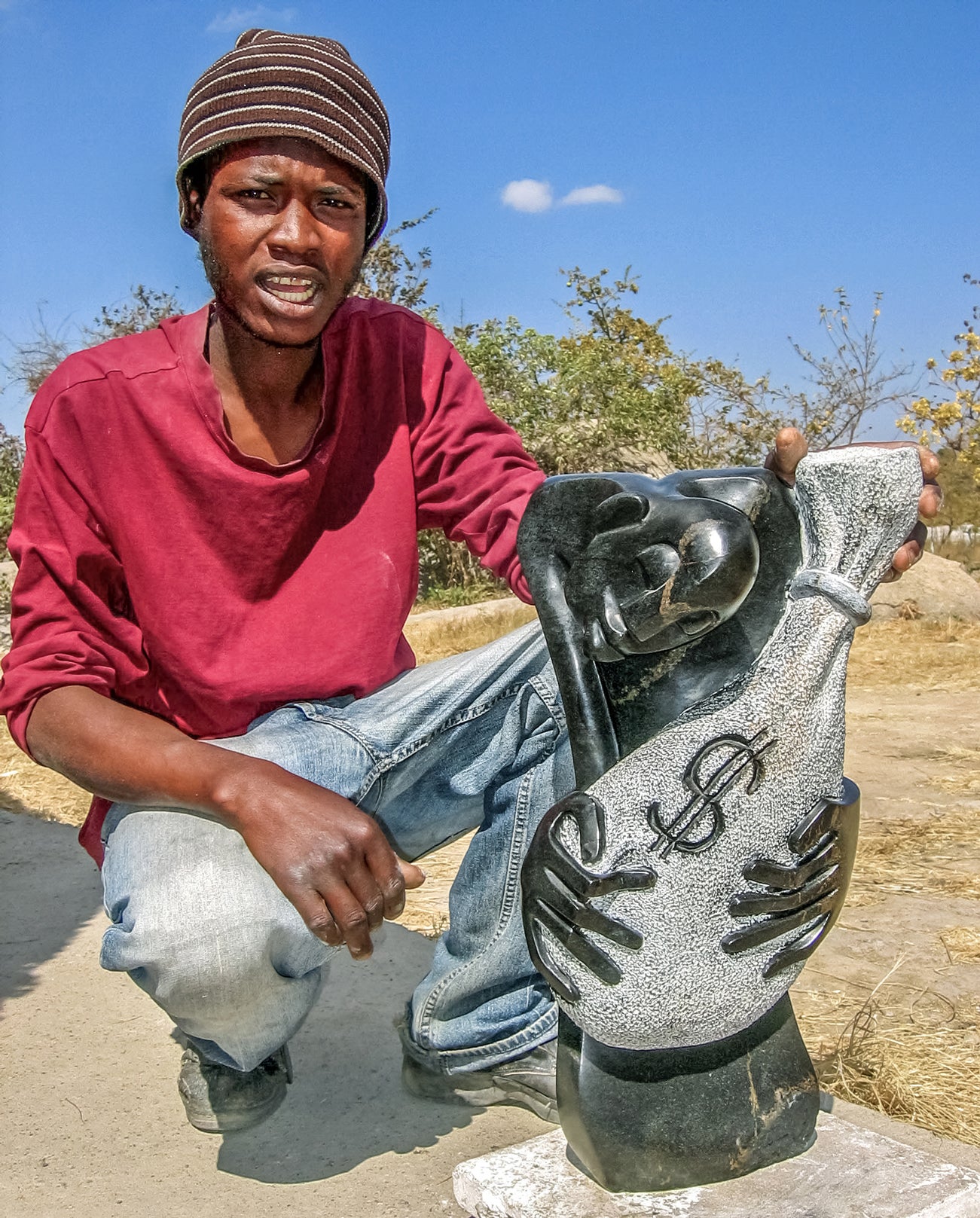 Melody Fombe with one of his sculptures  2008  Chitungwiza, Zimbabwe