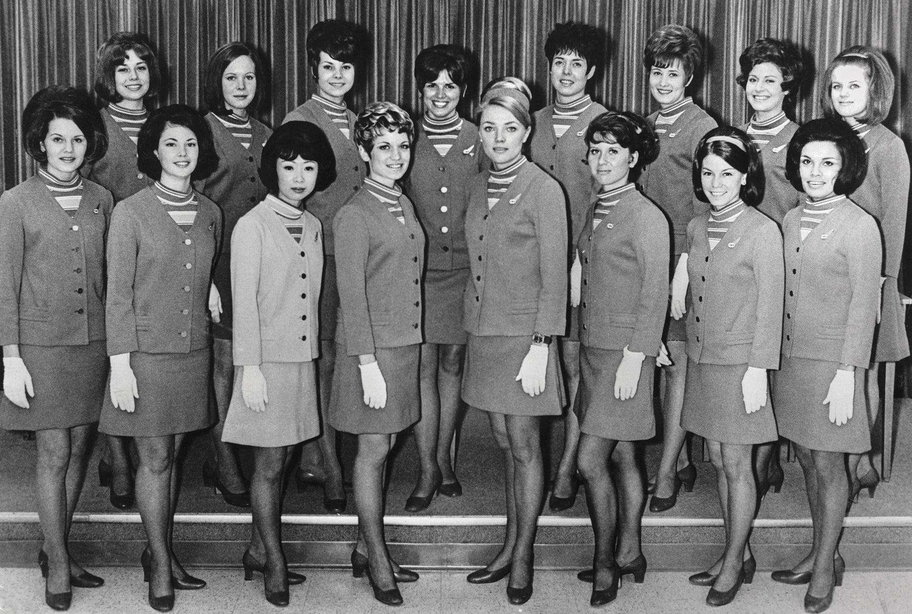 Graduating class portrait of Trans World Airlines (TWA) flight attendants wearing Dalton winter uniforms  1968
