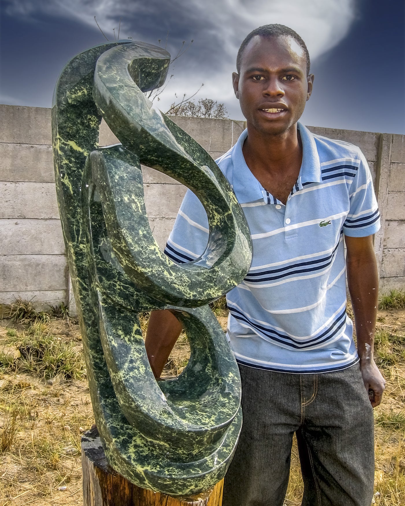 Pheoleen Gandari with one of his sculptures  2008  Chitungwiza, Zimbabwe