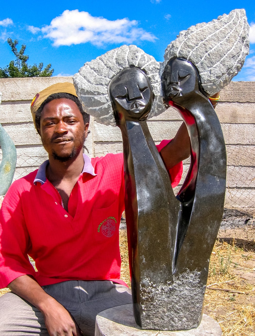 Wonder Mazhindu with one of his sculptures  2008 Harare, Zimbabwe