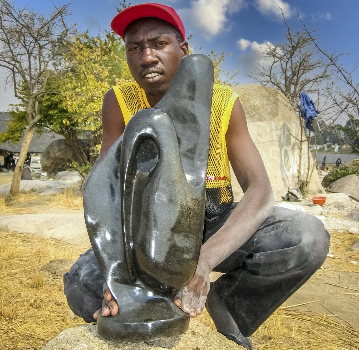 Tapiwa Jiri with one of his sculptures  2008  Chitungwiza, Zimbabwe