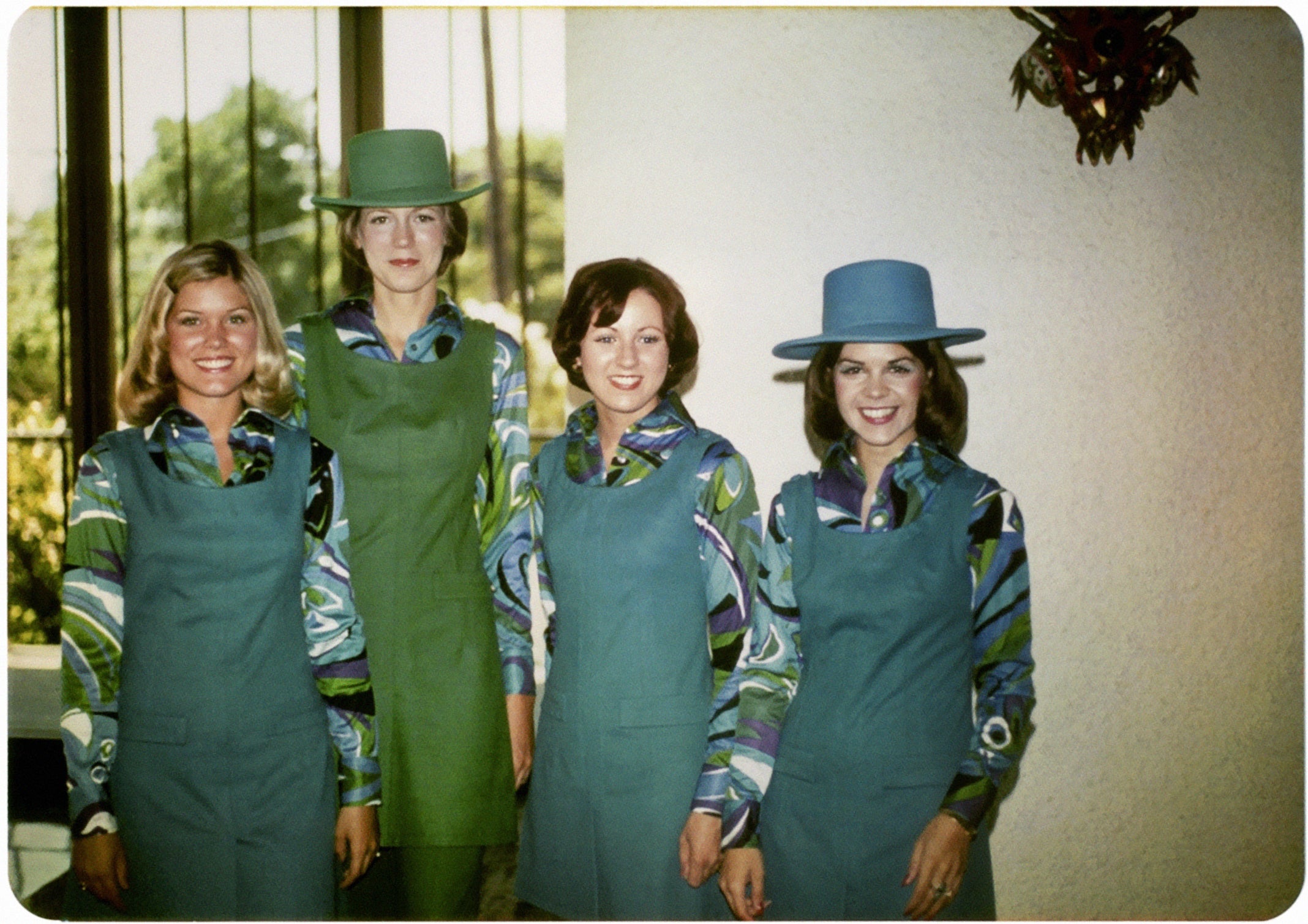Braniff International Airways hostess Christina (Rogers) Daley at far right, with Sandra Ganaway at far left, and two other flight attendants at graduation from Braniff Hostess College, Dallas, Texas  1974