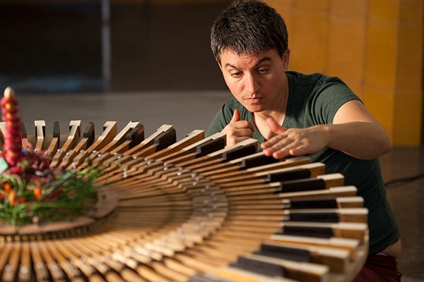 Terry Berlier at work on installation of Sounding Board exhibition at Thomas Welton Stanford Art Gallery  2012 Photo by Linda A. Cicero/Stanford University