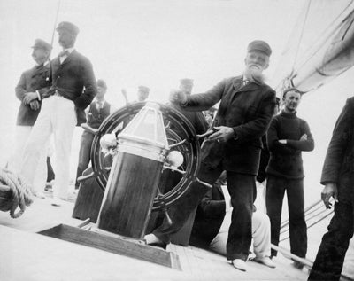 Skipper Hank Haff at the wheel of Defender  1895
