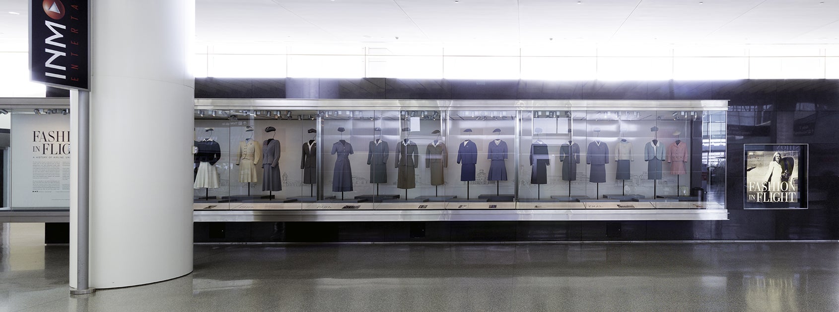 Installation view (partial) of Fashion in Flight: A History of Airline Uniform Design, International Terminal G  2016