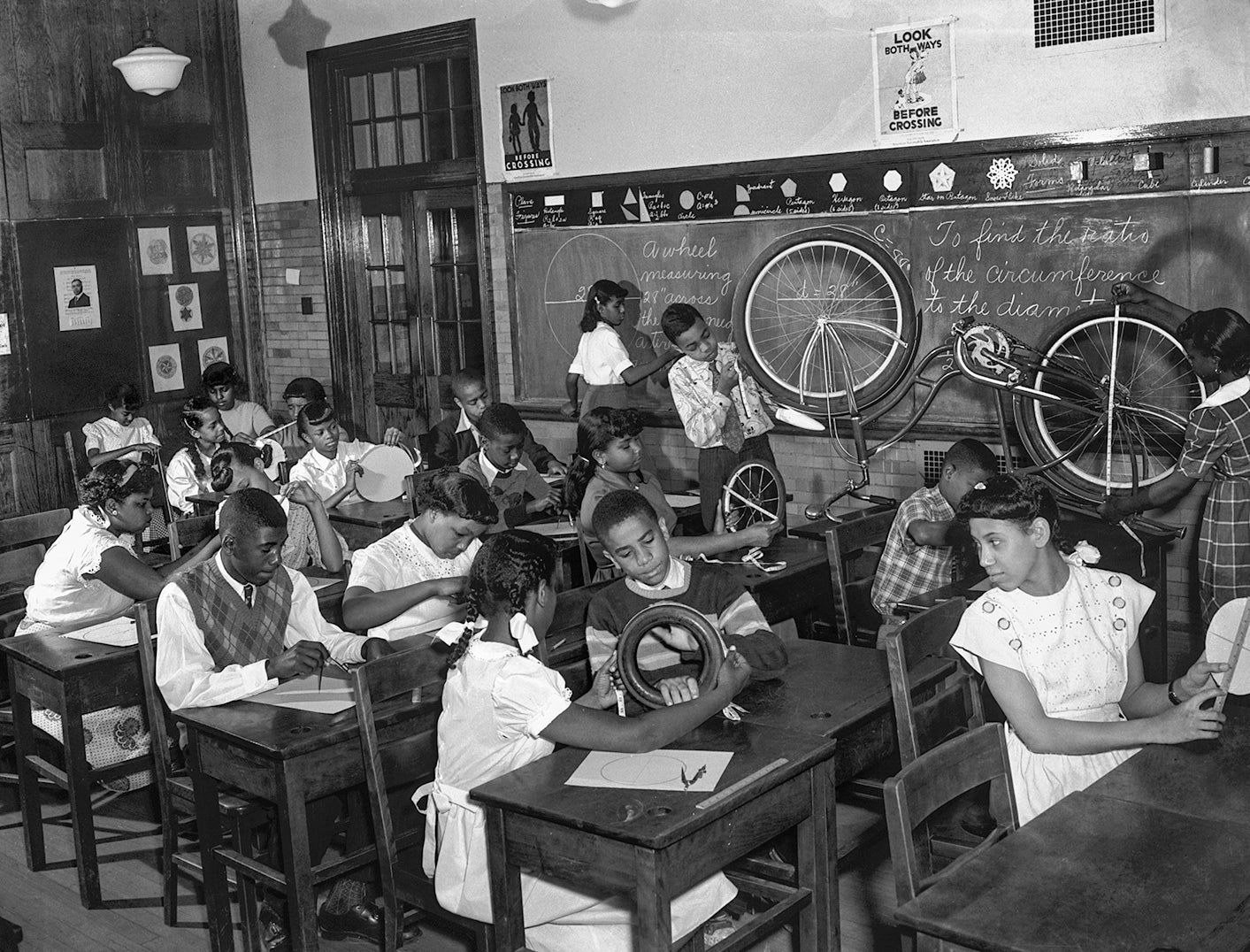 Students in a class measure wheels to determine diameter and circumference  c. 1950