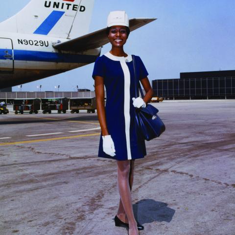 United Air Lines stewardess in uniform by Jean Louis 