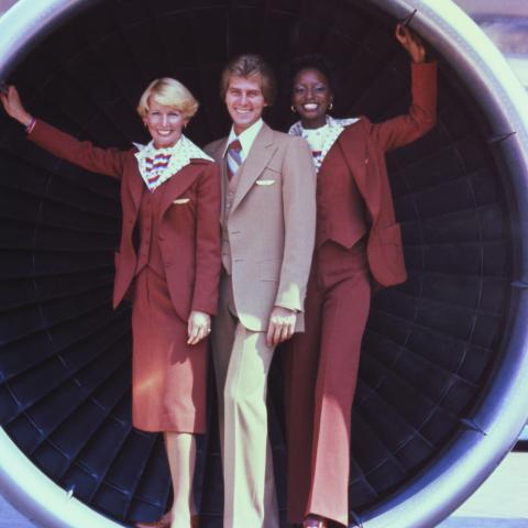 United Airlines flight attendants in uniforms by Stan Herman