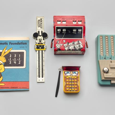 Children’s arithmetic book and calculating devices  c. 1940s–70s