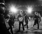 The Beatles walk across the field to the stage at Candlestick Park  August 29, 1966